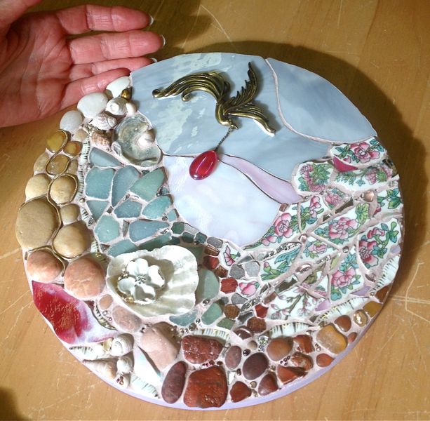 Mixed media mosaic made using stones, shells, jewellery, tumbled glass and vintage china