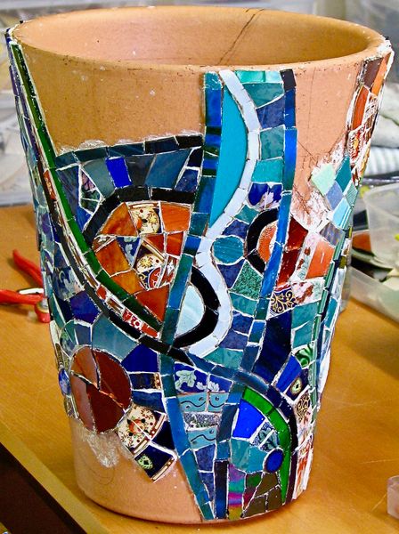 Jo's mixed media mosaic pot - created using vitreous glass tiles, stained glass, and re-cycled china.
