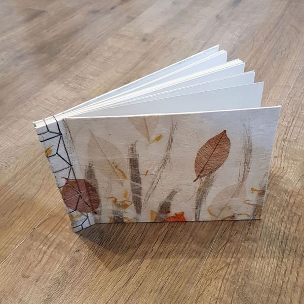 A book made with a handmade silk paper cover (check out our silk paper making class)