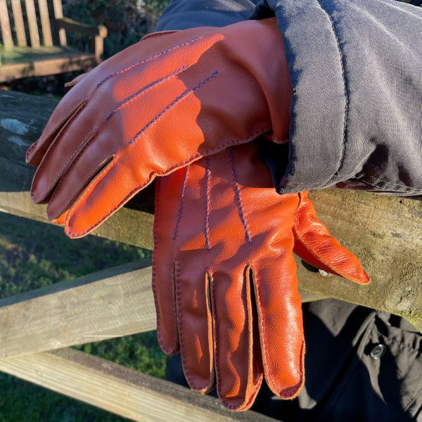 Handmade orange gloves