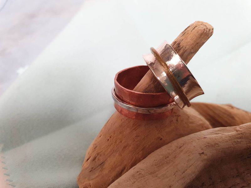 Silver and copper spinner rings