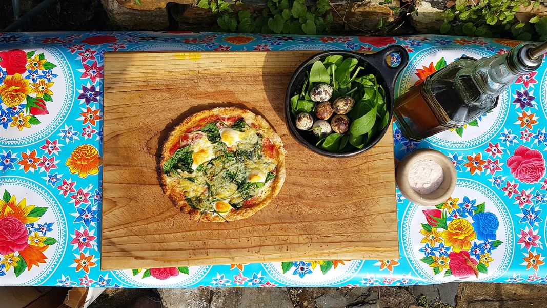GF sourdough pizza with quails eggs and spinach