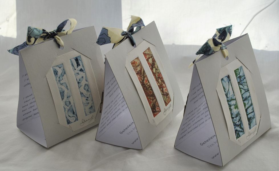 You can turn the packaging round and display the hand-inked collagraph proofs from these clips.