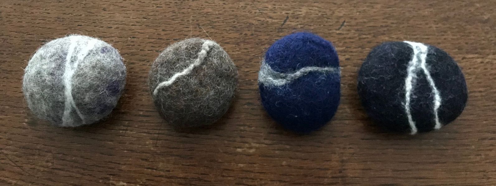 line of felted pebbles