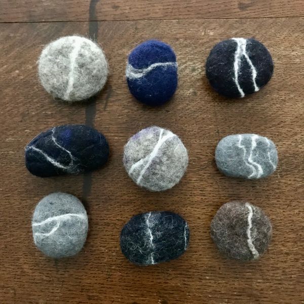 grid of wet felted pebbles