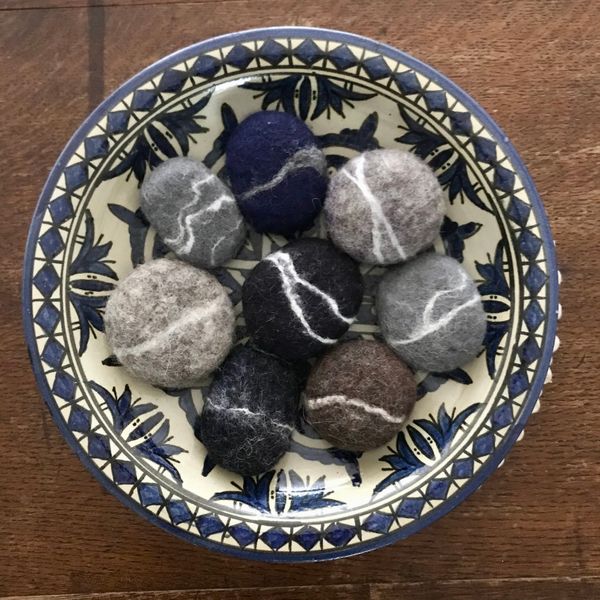 Bowl of wet felted pebbles