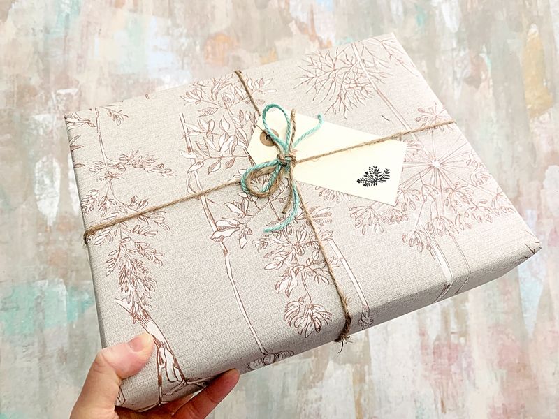 Delux hessian type wrapping paper with hand written hand stamped gift tag