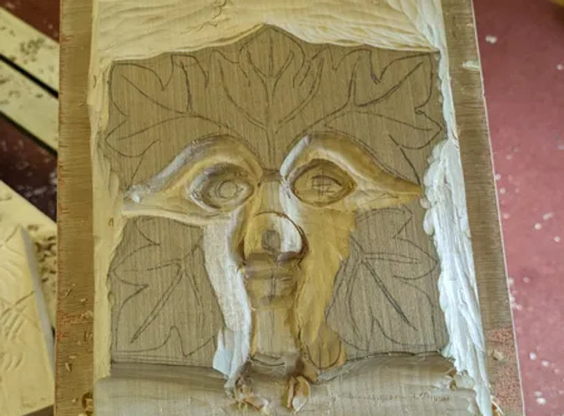 Part way though a green man carving