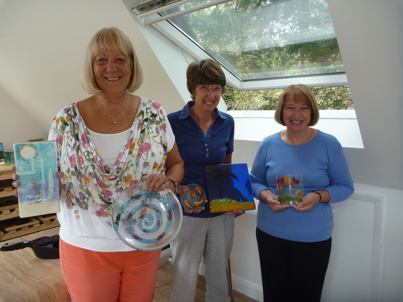 Three of our weekly glass fusing students show off their achievements from the previous week 