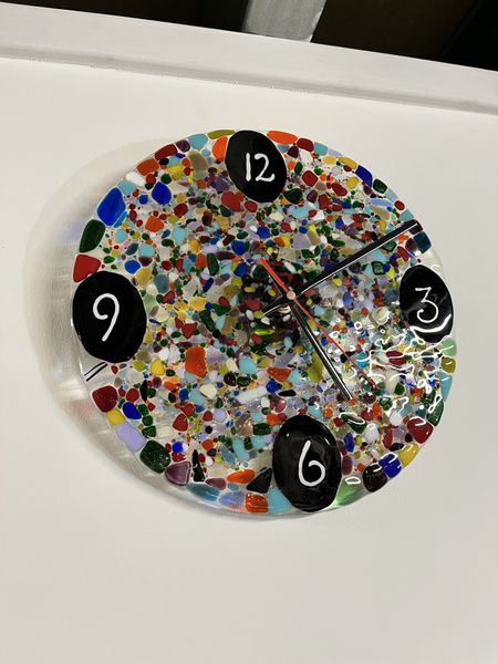 A fused glass clock made in the Vitreus Art studio