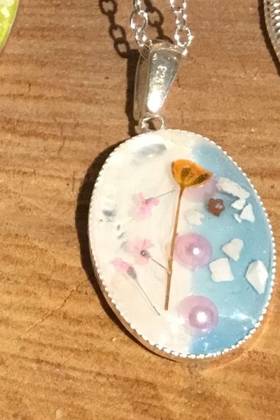 Real pressed flowers and silver necklace
