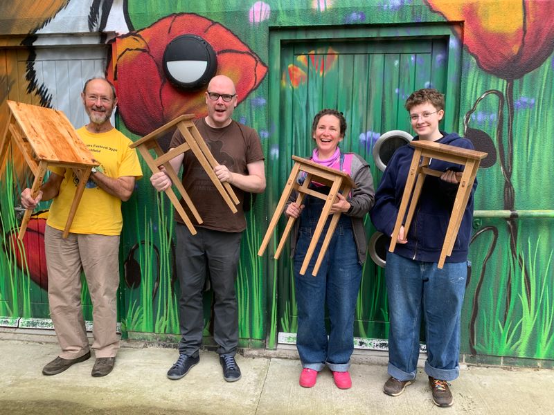 Four happy students on day 3, with their wonderful handmade table. 