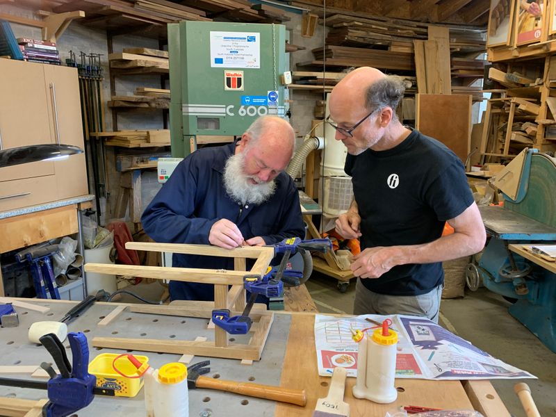 Finbarr helps with the final part of the assembly - fitting the hardwood wedges.