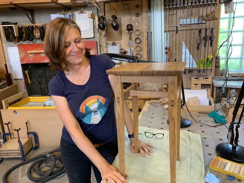 A proud student and her table