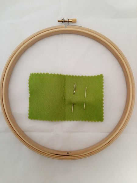 Needle holder and embroidery hoop