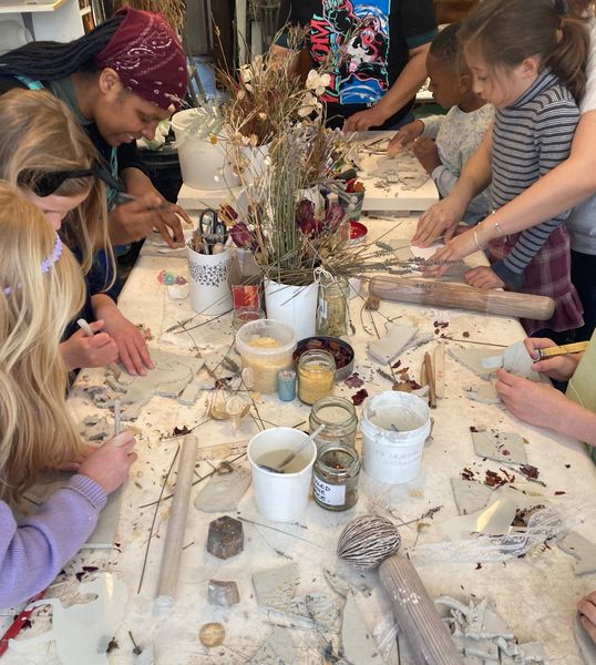 Children & parents at a porcelain workshop