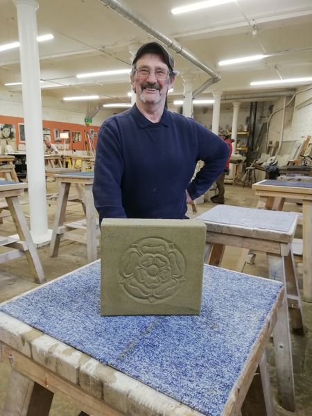 A student and his very first stone carving 