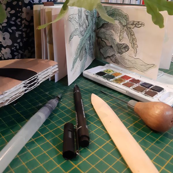 Sketchbook and sketching and bookbinding tools