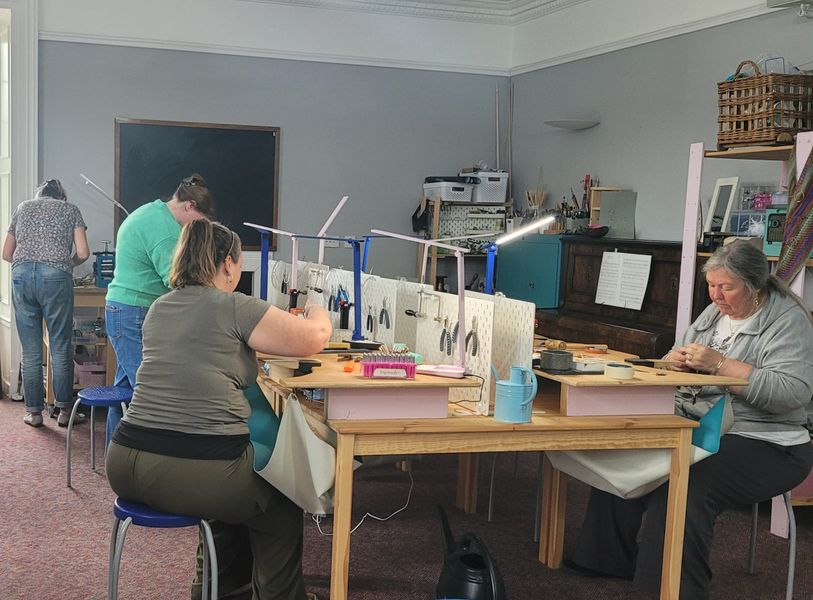 Workshop with students working on silver clay project
