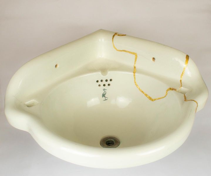 This broken sink was repaired and goldleaf applied.  