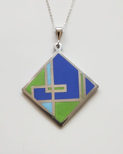 A finished enamelled pendant.