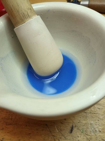 Grinding the enamel grains.