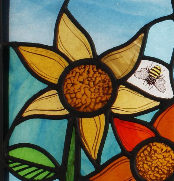 Painted and leaded small panel- flower & bee.
