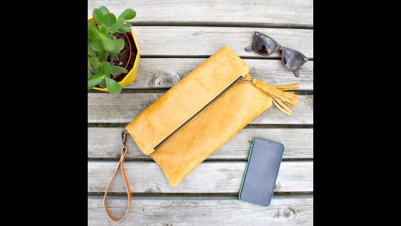 Mustard clutch bag flat lay