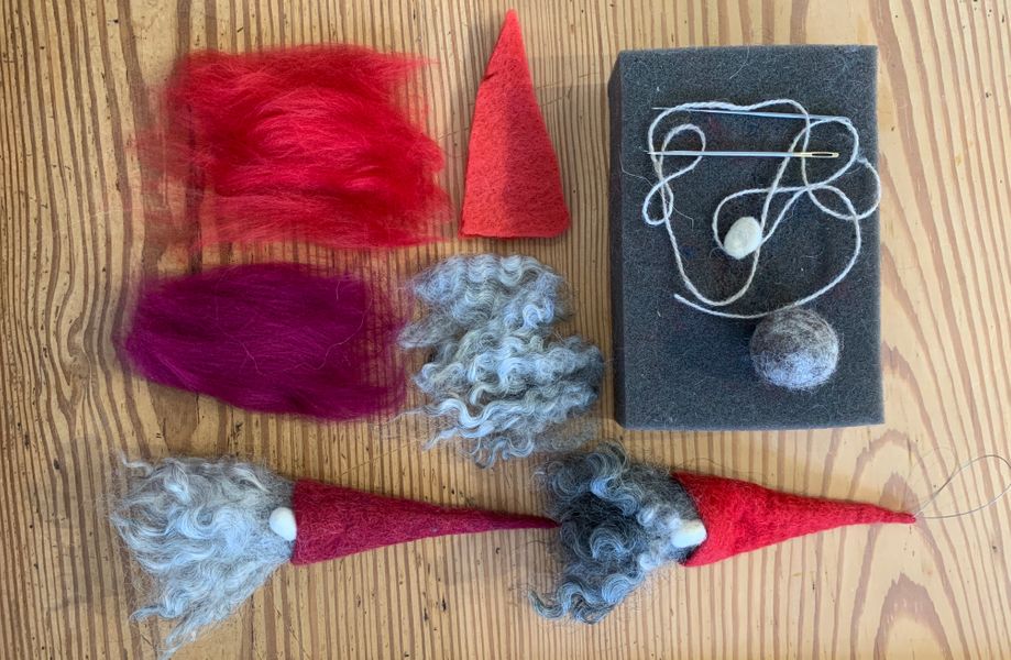 Some materials/equipment and two hanging Tomte decorations