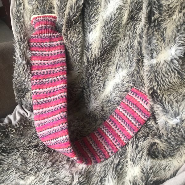 Extra long hot water bottle with handmade cover (yarn design Claire)