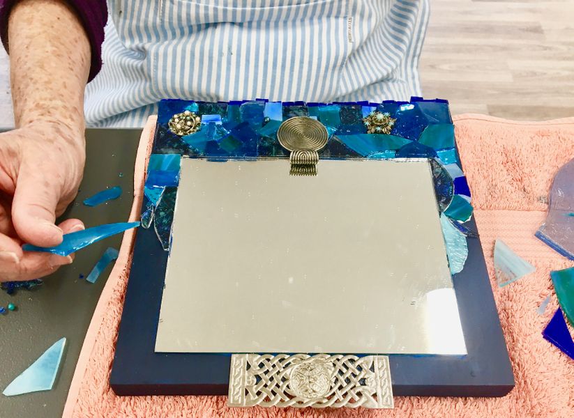 Jane's Deep Blue mosaic mirror - made using stained glass, smalti and old jewellery.
