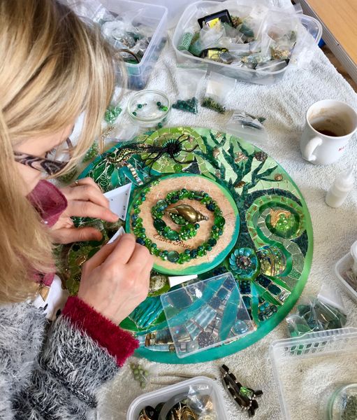 Wendy working on her green mandala mosaic