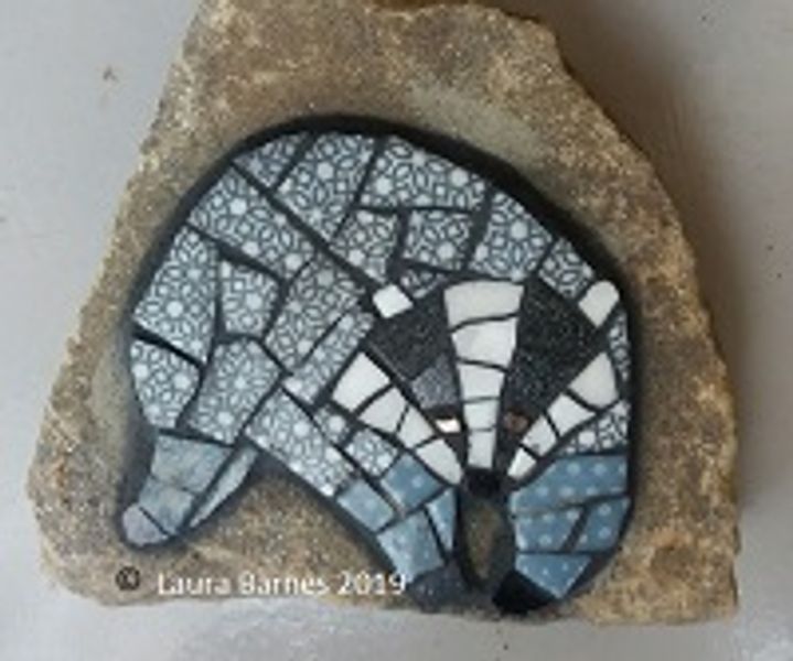 Badger mosaic on stone.