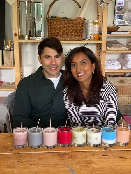 A couple with their colourful candles