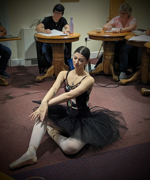 Ballerina seated
