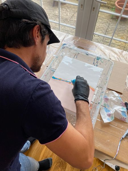 A new acrylic pour artwork being made