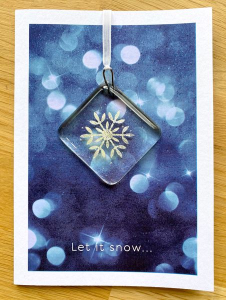 Real silver snowflake in hanging decoration that can be used on a Christmas card (provided).