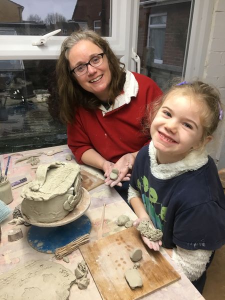 Mum and daughter happy to have made a beautiful fairy house