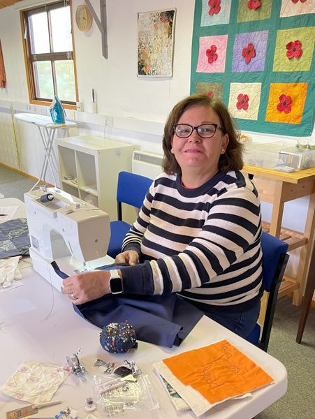 Woman at sewing machine