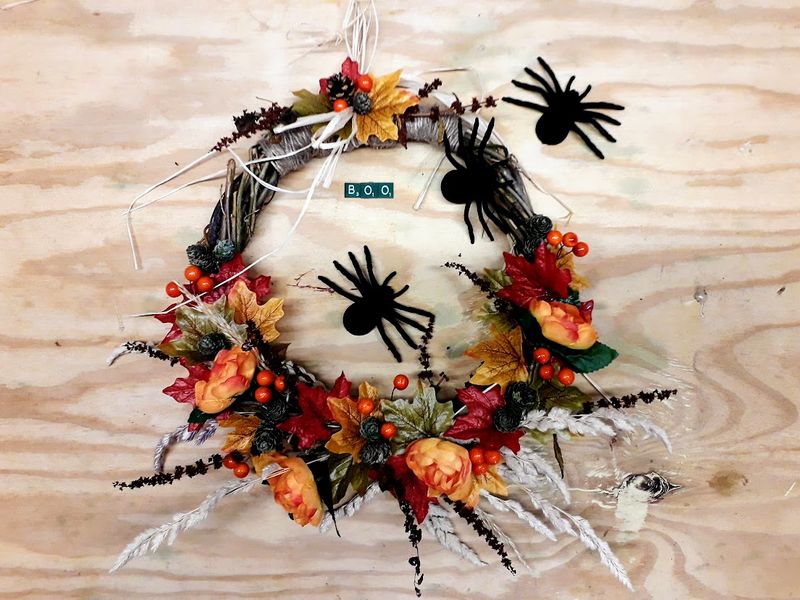 With the addition of some creepy crawlies transform this autumn wreath which will  compliment your halloween decor.   