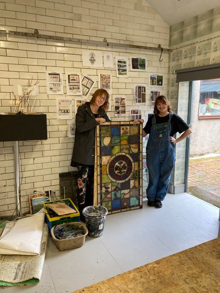 Jo and Beth preparing to install the August 2024 window