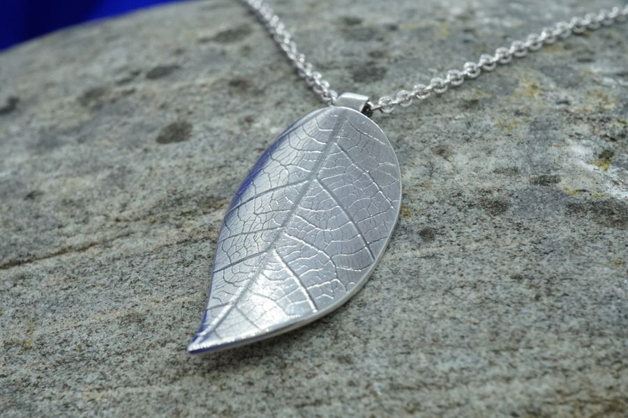 Silver leaf texture pendant on chain