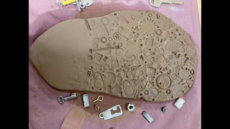 Pressing objects into clay