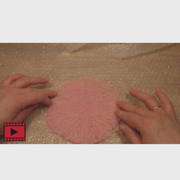 video tutorial shows you how to wet felt merino wool to make the ballerina dress