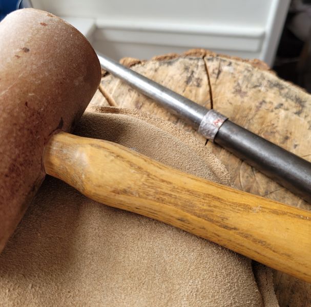 The main spinner ring band on a mandrel having been shaped with a rawhide mallet.