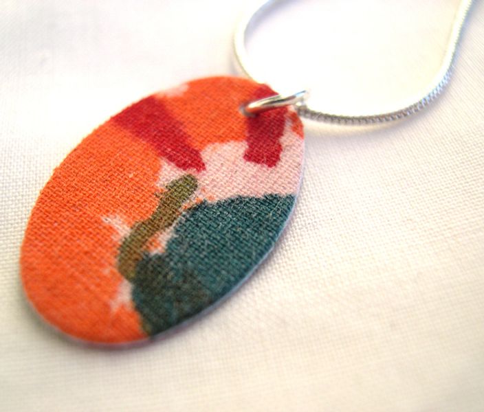 Silver Plated Hardened Fabric Oval Pendant with Lobster Clasp.