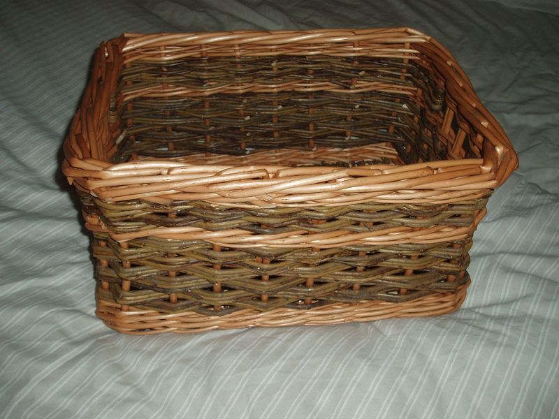 Square basket with side holes for handles made using traditional English techniques
