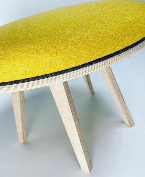 Everybody leaves with their very own midcentury modern footstool