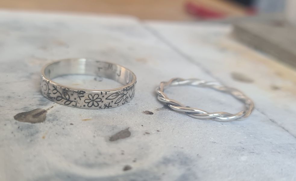 A twisted wire ring and stamped one