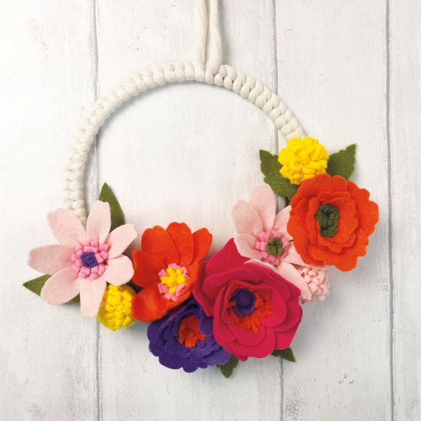 Hang the felt flower wreath up in your home.